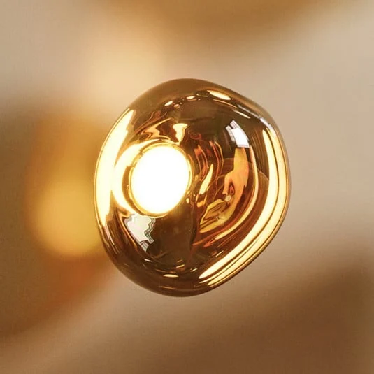 Aplique de pared LED Melt de Tom Dixon, Ø 50 cm, color bronce