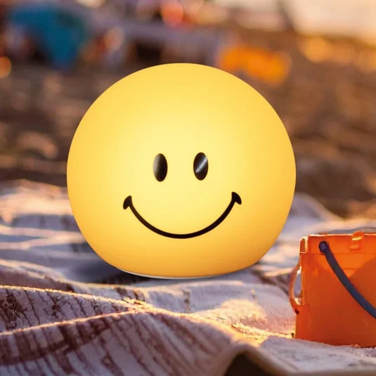 Linterna LED recargable Smiley, amarilla, Ø 13 cm, silicona